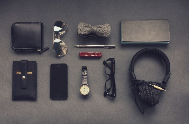 Accessories - black corded headphones near eyeglasses