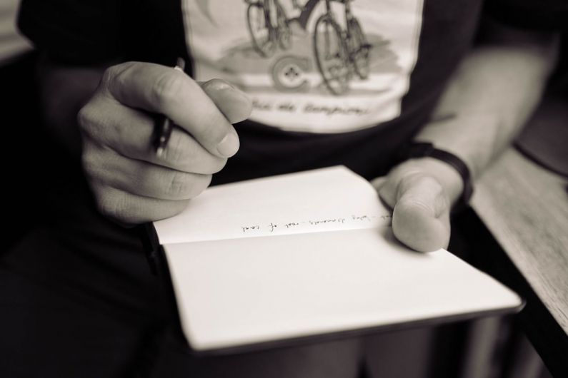 Tasting Notes - person writing on notepad
