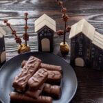 Sweetness - chocolate bar on black plate