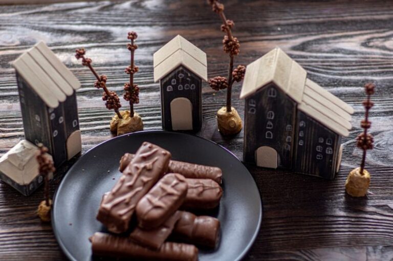 Sweetness - chocolate bar on black plate
