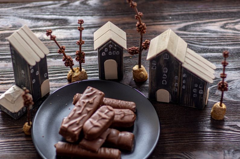 Sweetness - chocolate bar on black plate