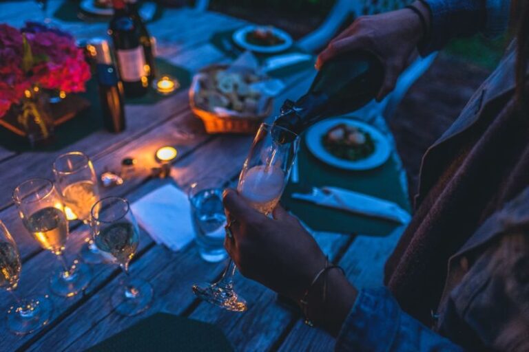 Tasting Event - person putting wine on flute glass