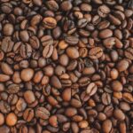 Coffee Beans - brown coffee beans on brown wooden table