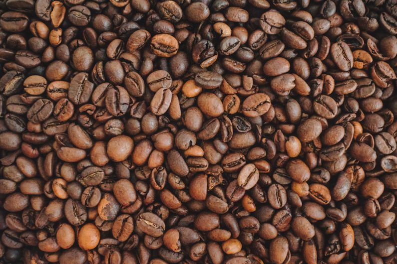 Coffee Beans - brown coffee beans on brown wooden table