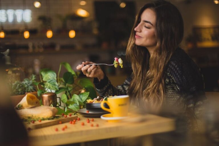 Functional Coffee - woman holding fork in front table