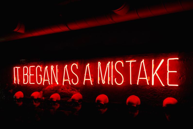 Mistakes - a neon sign that says itbegan as a mistake