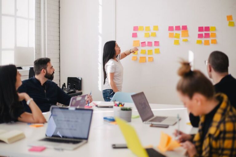 Training - woman placing sticky notes on wall
