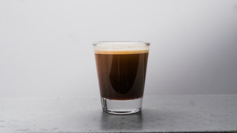 Espresso Shot - clear drinking glass with brown liquid