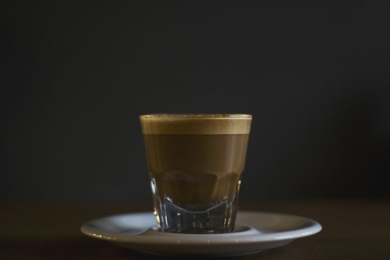 Espresso Crema - coffee filled rock glass on saucer