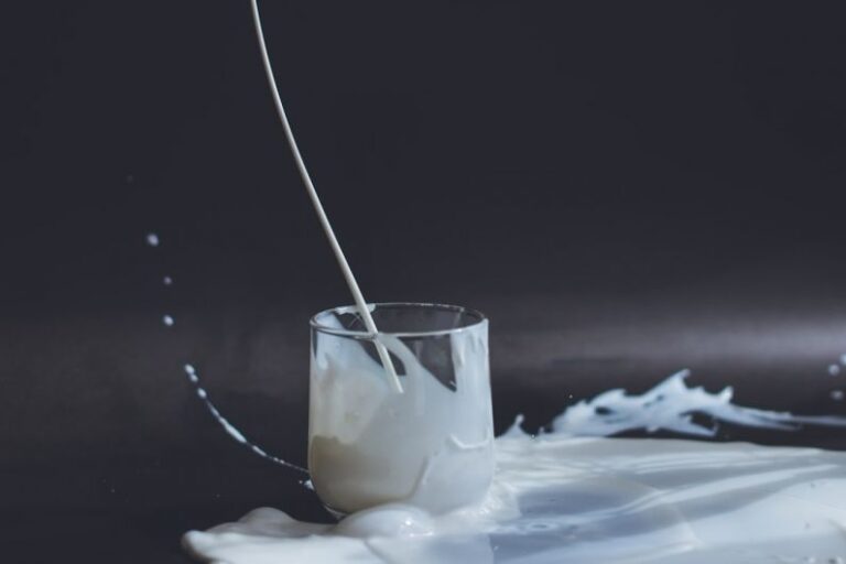 Soy Milk - clear drinking glass with yellow liquid