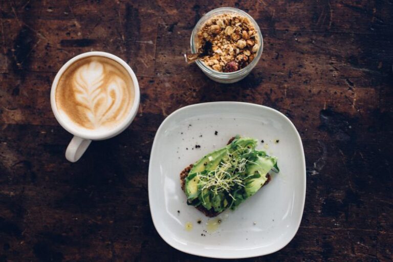 Rosetta - sliced vegetable on plate near coffee cup and nuts on glass container
