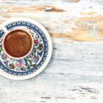 Turkish Coffee - flat lay photography of cup filled with coffee