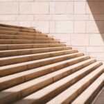 Challenges - toddler's standing in front of beige concrete stair