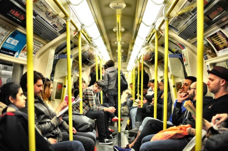 Urban Life - photo of group on people sitting inside train