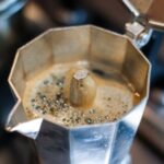 Moka Pot - coffee in silver cup with coffee