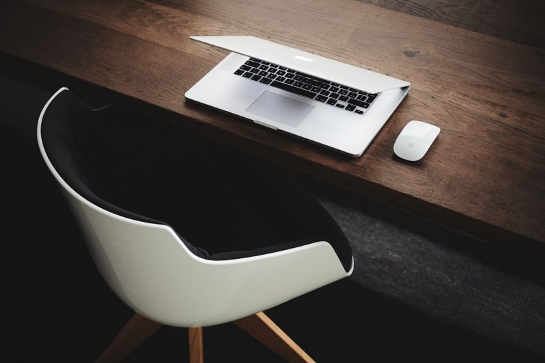 Work From Coffeehouse - Apple MacBook beside computer mouse on table