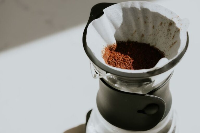 Third Wave - a close up of a coffee pot filled with coffee