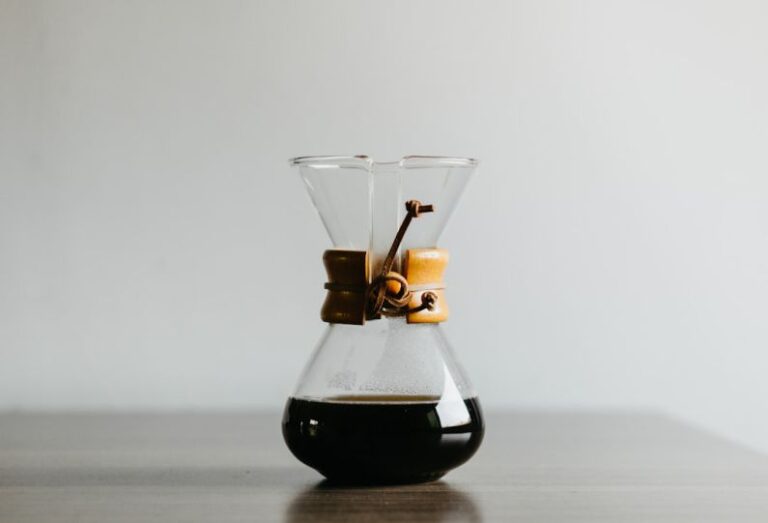 Chemex - clear glass decanter filled with black liquid