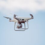 Advanced Equipment - white DJI drone in mid air