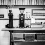Grinders - black and silver coffee maker on black table