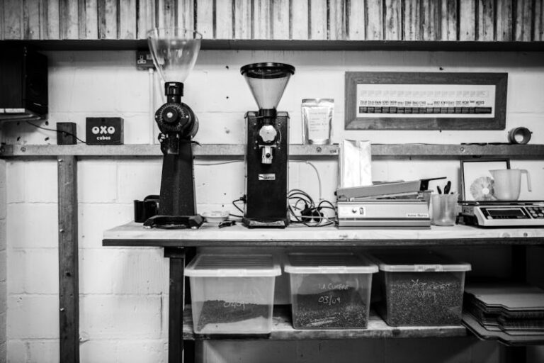 Grinders - black and silver coffee maker on black table